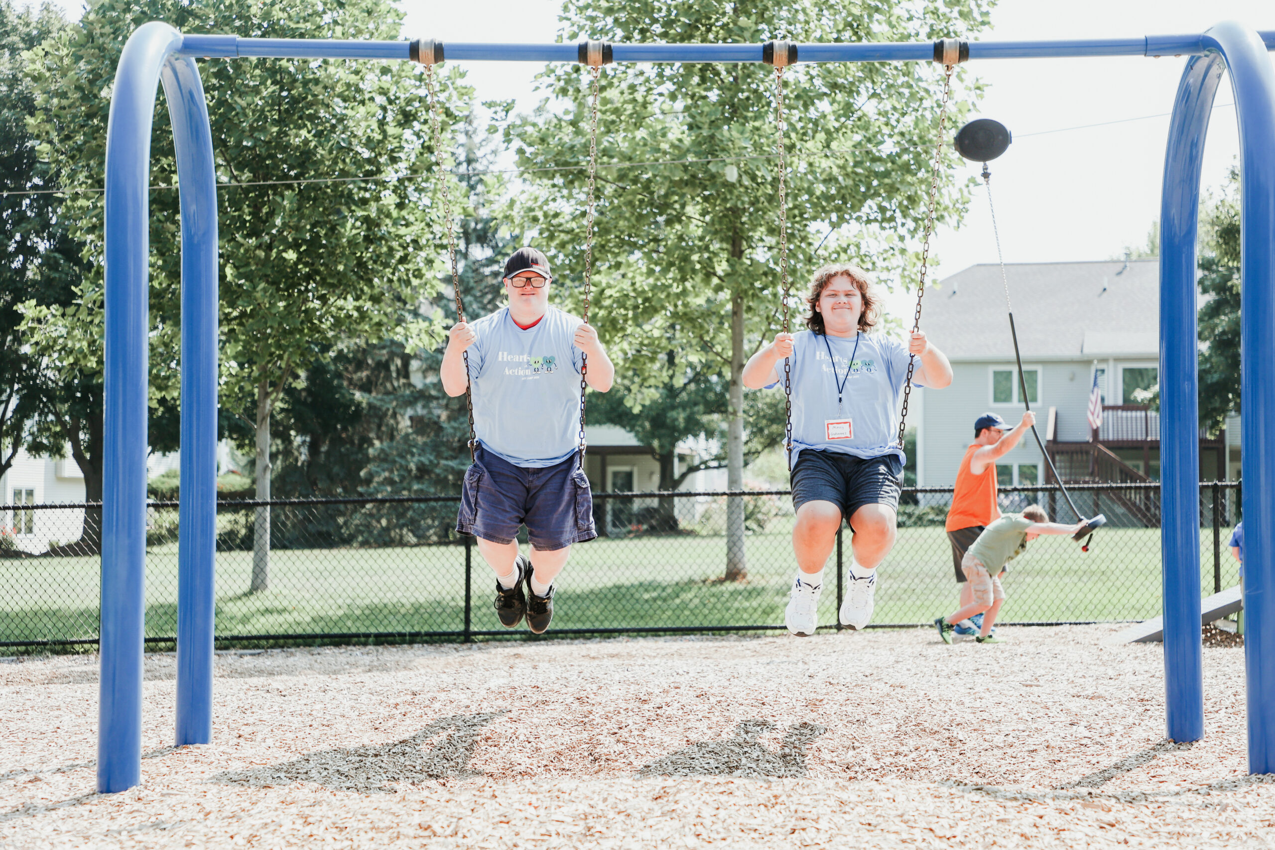 Mentor and student from the Holland/Zeeland special needs program posing for a photo after playing tennis