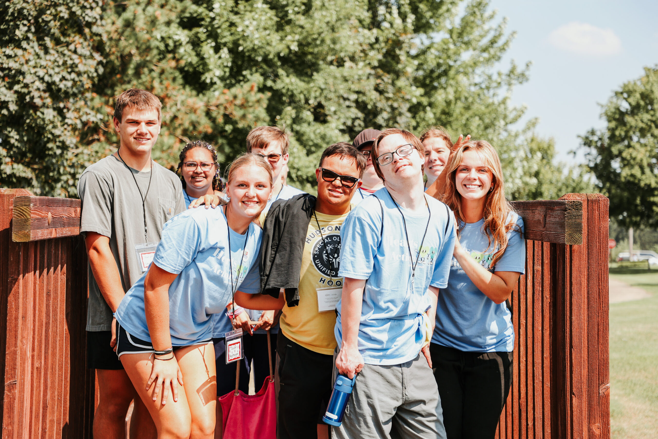 Mentors for the Holland/Zeeland Special needs program hugging for a photo